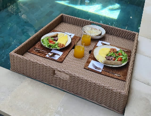 Floating breakfast tray on the private pool at La Calma villa Uluwatu Bali
